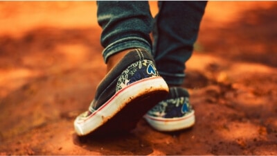 sneakers on a muddy road