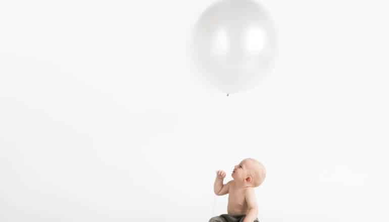 baby with a balloon