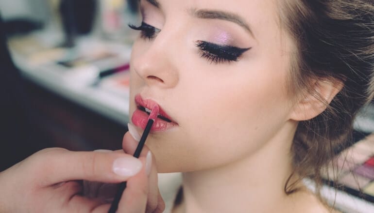 applying lipstick