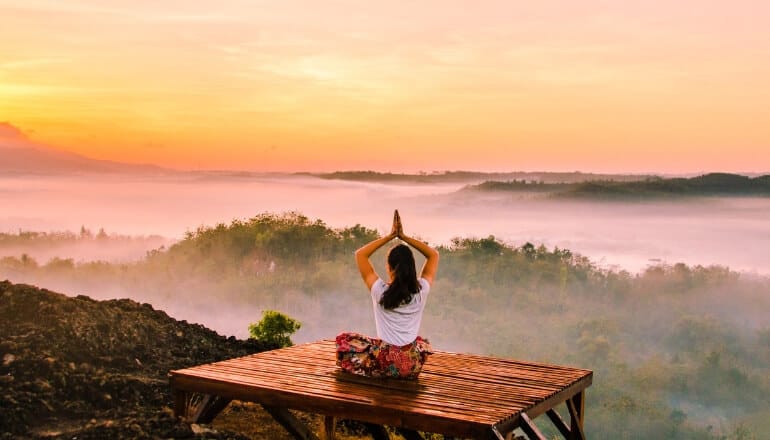 woman meditation on mountain