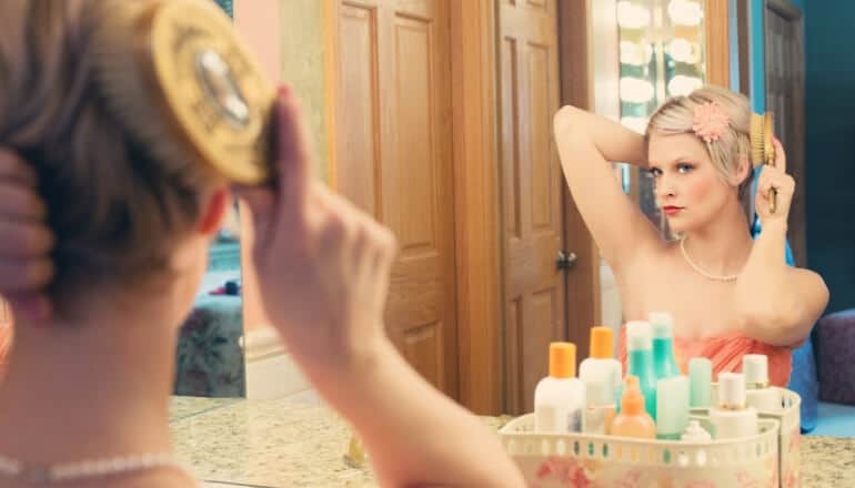 woman brushing here hair