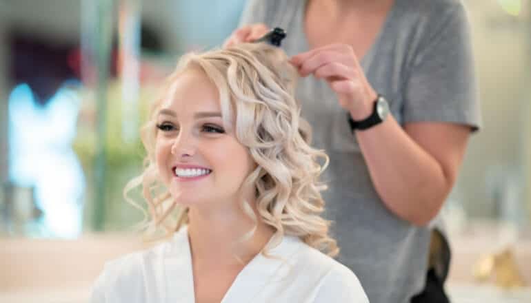 woman having her hair styled