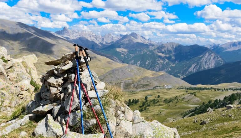 hiking sticks piled against a rock