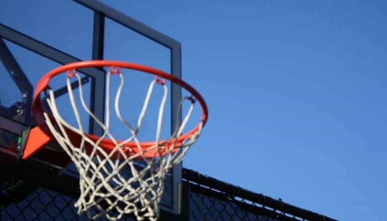 basketball hoop against a blue sky