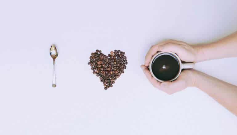  i love coffee written with a spoon and coffee beans