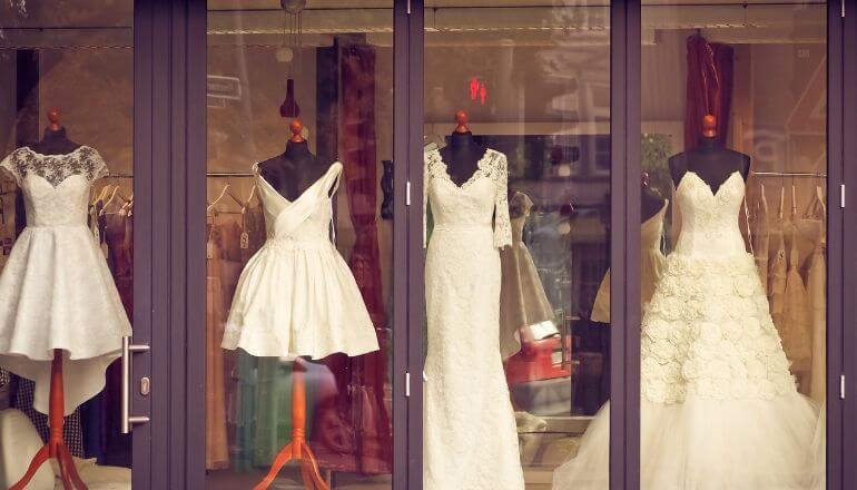 wedding dresses in a window