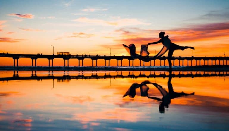 woman dancing at sunset