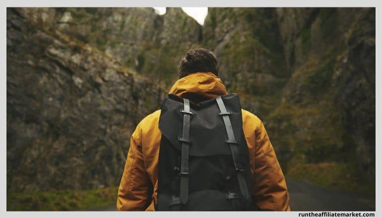 backpacker in a green valley