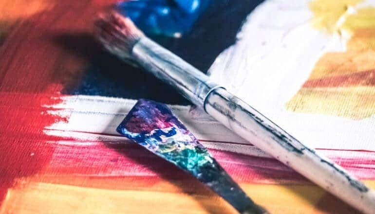 paint brushes laying on table