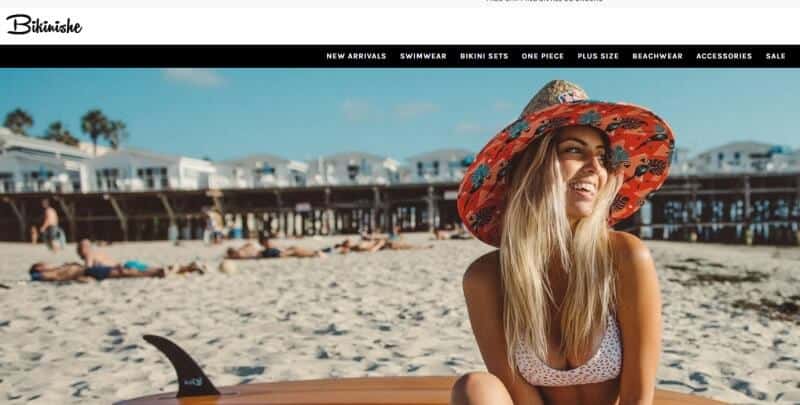 screenshot of a woman on a beach in a bikini on the bikinishe webpage