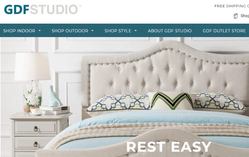 screenshot of the gdf studio website featuring a white bed and bedroom set