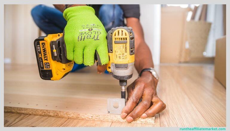 dewalt power drill being used to drill a piece of wood