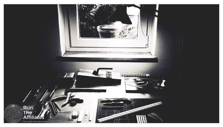 workbench with various woodworking tools on it, photo is in black and white