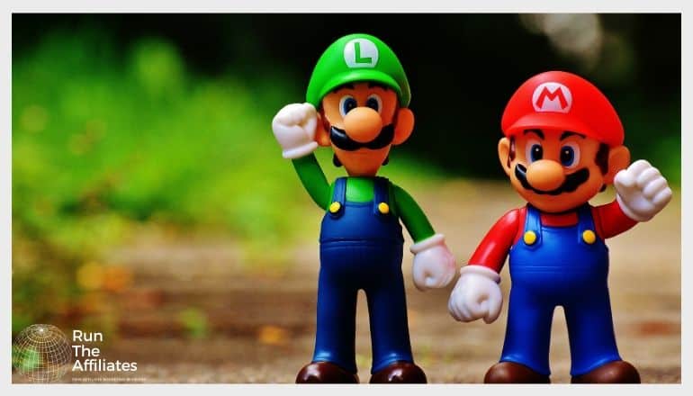 mario and luigi action figures on a gravel path