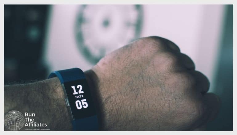 close up image of a fitness tracker on a mans arm