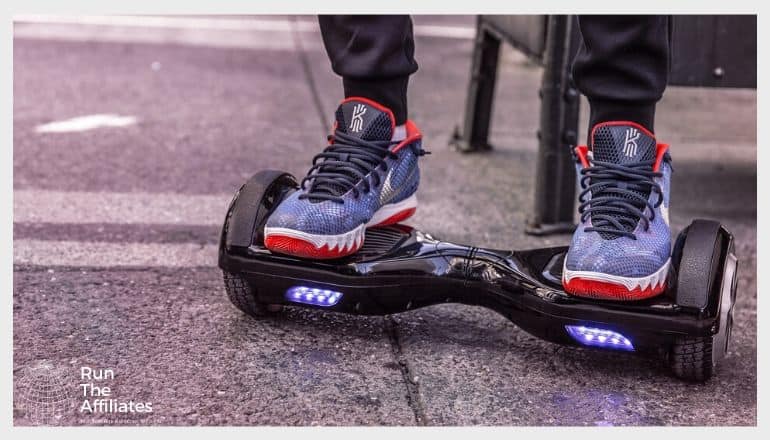 man in red white and blue sneakers on a hoverboard