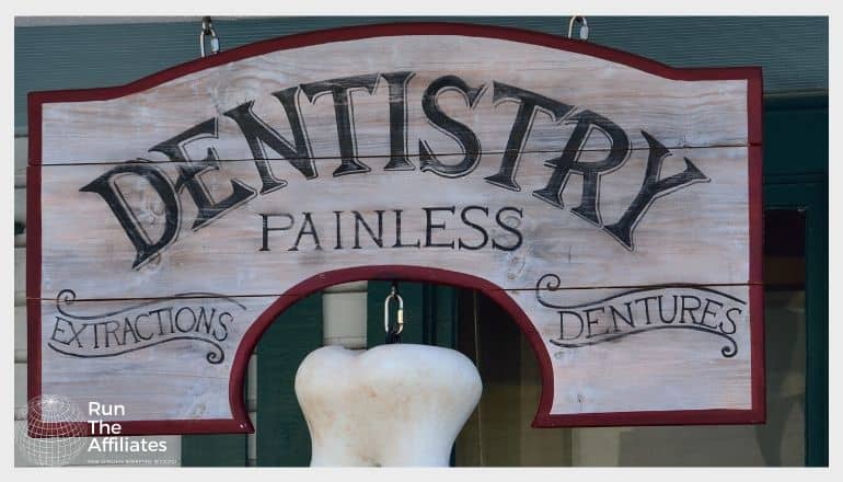 wooden dentistry sign