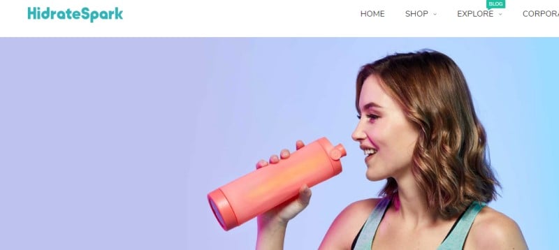 screenshot of the hydrate spark website featuring a woman drinking for an orange hydrate spark water bottle