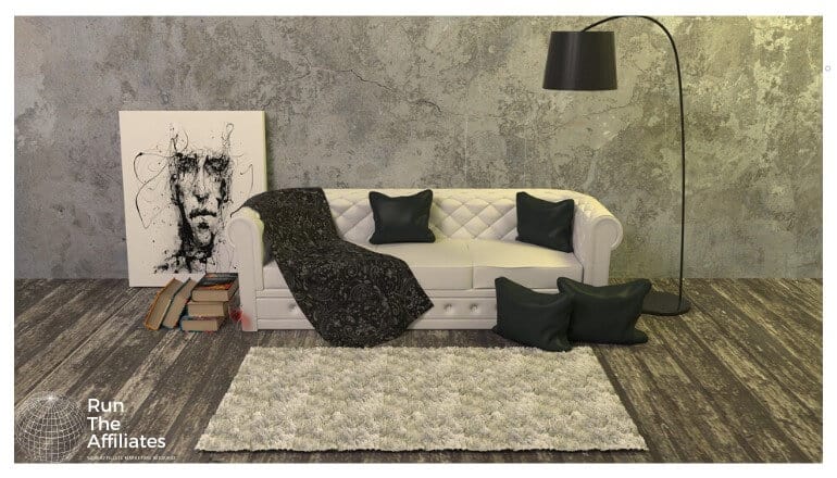 rug on a wood floor in front of an off-white sofa with black pillows and blanket