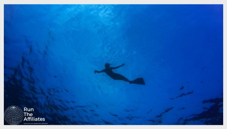 scuba diver in a deep blue sea