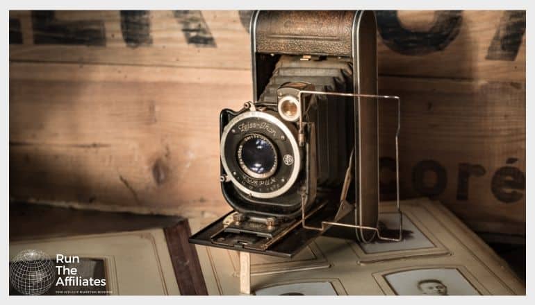 antique camera resting on a vintage photo album