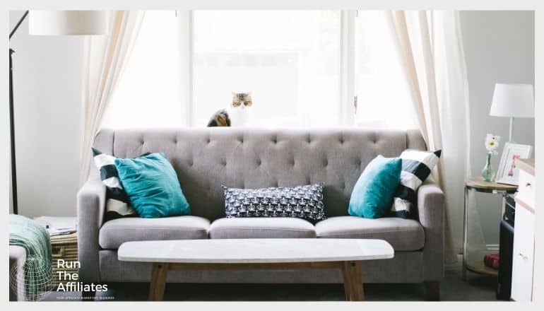 living room with a grey sofa and blue pillows