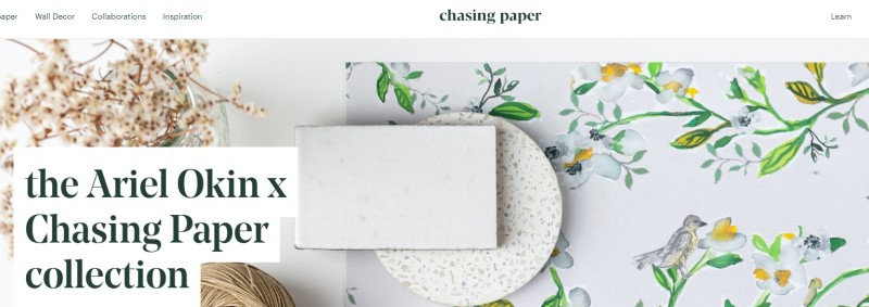 chasing paper screenshot featuring wallpaper with flowers and birds adorning it