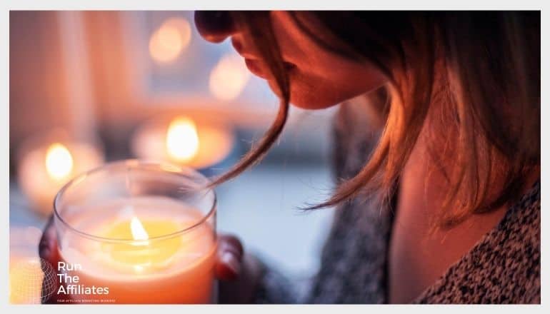 woman holding a candle close to her face