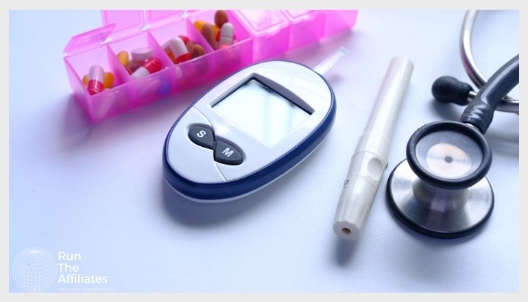 device for checking blood sugar, pills and a stethoscope laying on a table