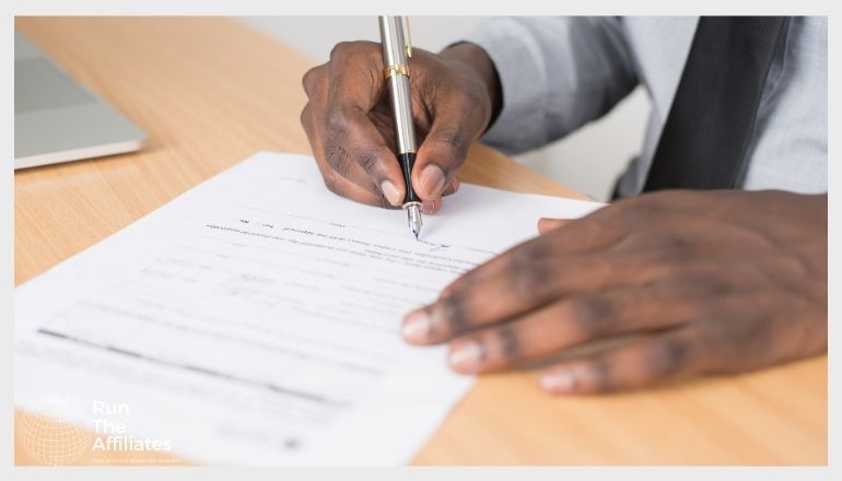 man filing out forms